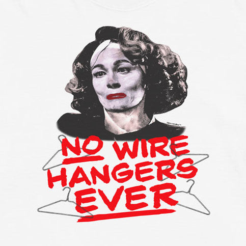 A white short-sleeve t-shirt with a graphic print of a woman's portrait and the text 'NO WIRE HANGERS EVER' in red and black, displayed flat against a light cream background.