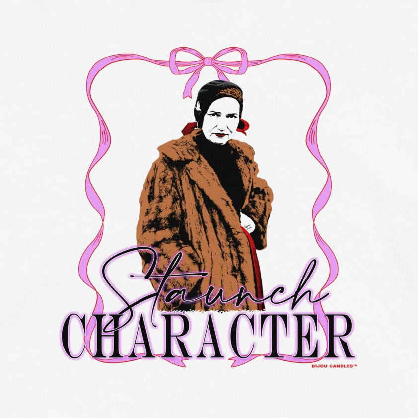 A white short-sleeve t-shirt with a graphic print of a woman in a brown fur coat inside a pink frame, with the text 'Smile CHARACTER' written below.