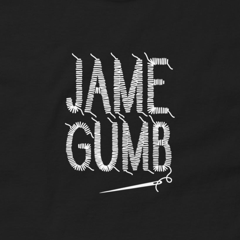 Black t-shirt with white 'JAME GUMB' text design on a plain background