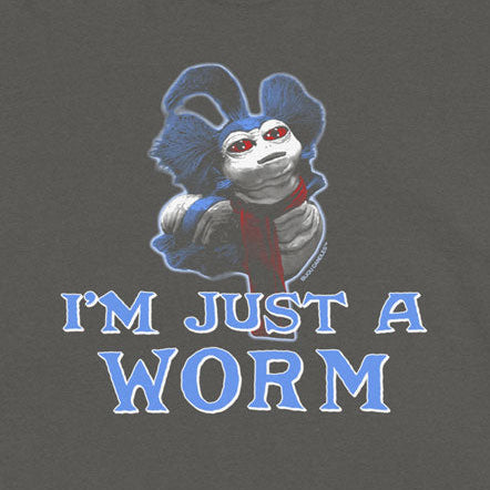 A dark gray short-sleeve t-shirt with a graphic of a cartoon worm wearing a blue jester and red necktie, with the text 'I'M JUST A WORM' in blue outlined letters below.