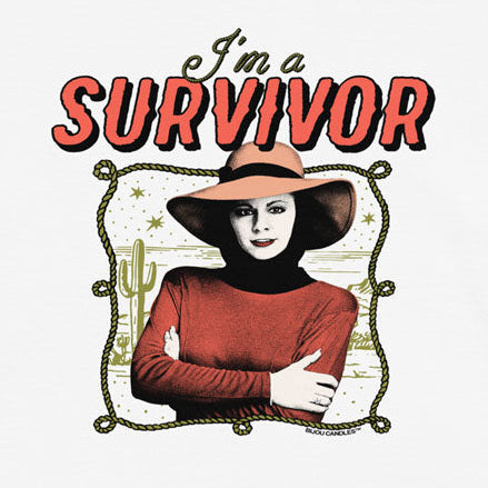 A white short-sleeve crewneck t-shirt featuring a graphic print of a woman in a cowboy hat and red top with the text 'I'm a SURVIVOR' in red and black.